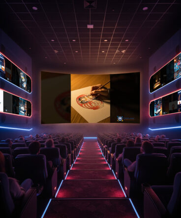 imagens-IA-video-daruma Imagem representando uma sala de cinema em clima high-tech, com neon vermelho, azul e rosa contornando corredores e painéis laterais. A plateia assiste, em tela gigante, ao vídeo produzido pela Manghá para a Daruma: uma narrativa que apresenta a origem do símbolo, seu significado e o anúncio de que a marca está oficialmente registrada. Nas laterais, projeções complementam a ambientação, enquanto o take central mostra a ilustração do daruma sendo traçada sobre o papel — reforçando o conceito de identidade, tradição e proteção de marca.